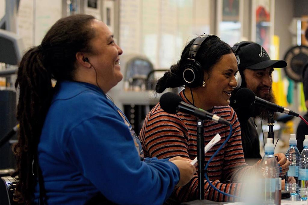 Three presenters in the middle of a Māori radio show