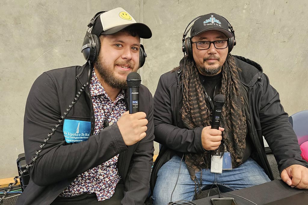 Two Māori radio presenters during an outside broadcast